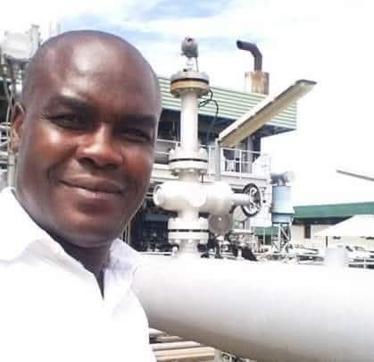 LMS team member at an industrial facility with piping and plant infrastructure